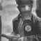 Young boy wearing gas mask